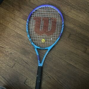 Wilson blue tennis racket